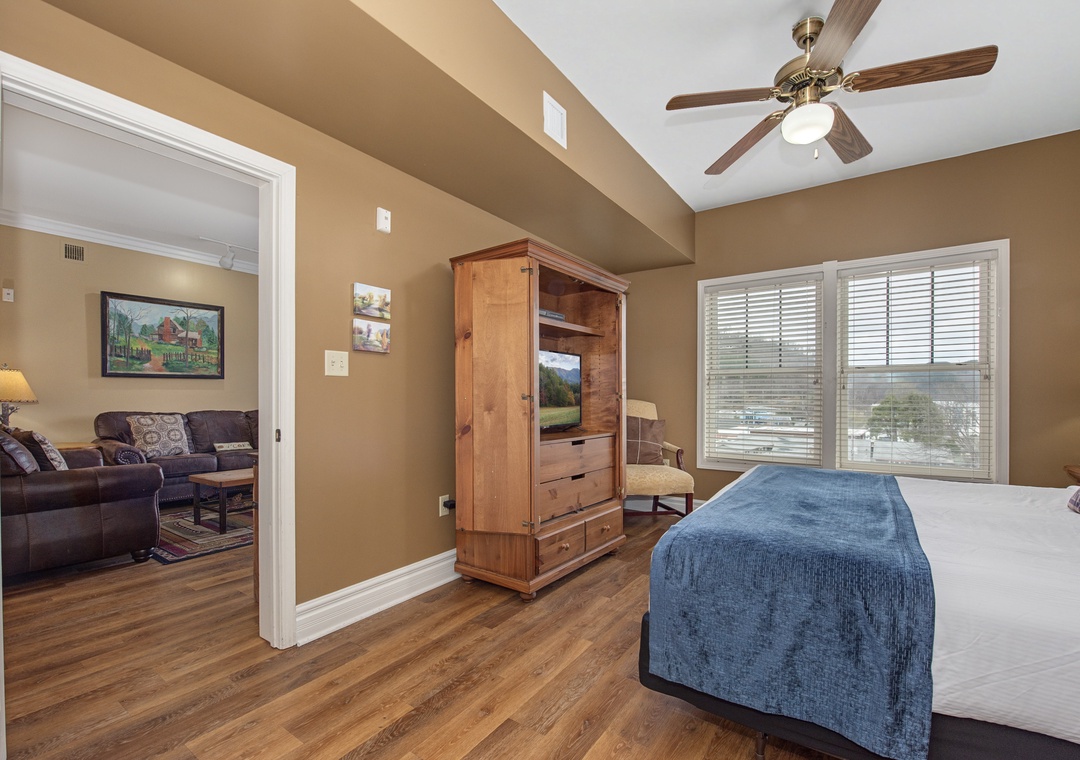 Your spacious bedroom features exposed beams, gleaming hardwood floors, and a ceiling fan for ultimate comfort.