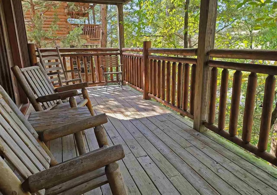 Relax in your private screened porch with rocking chairs, watching sunlight dance through the trees as gentle breezes flow through this peaceful retreat.