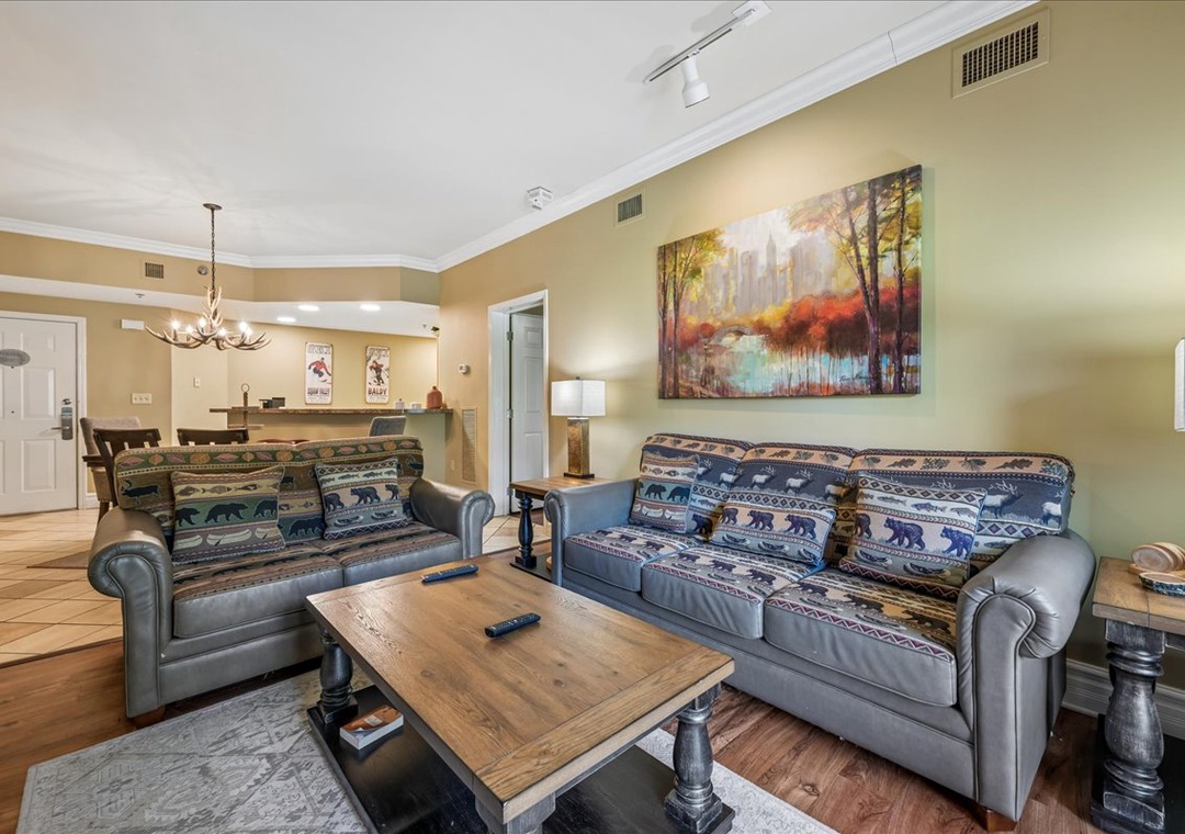 Settle into your cozy living room with comfortable sofas and rustic charm, perfect for relaxing after mountain adventures.