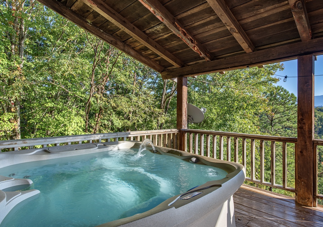 Soak away your cares in your private hot tub while gazing out at lush forest and distant mountain peaks—pure serenity on your own covered deck.
