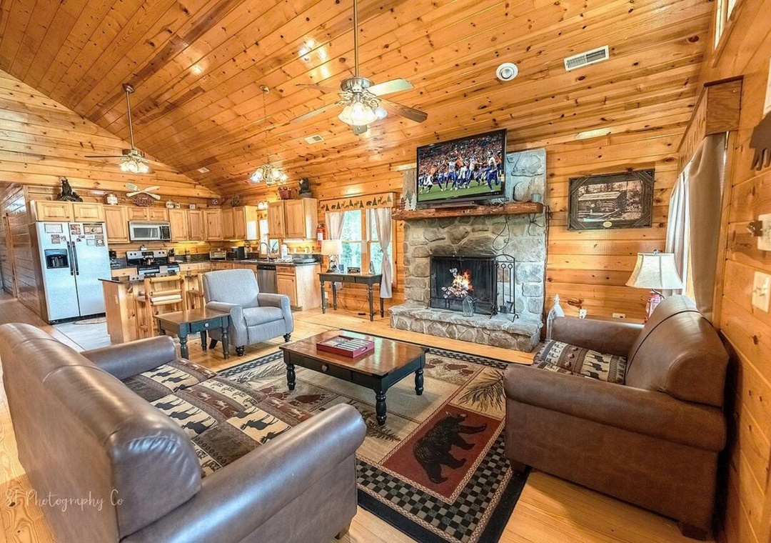 Unwind in this cozy cabin with warm wood tones, plush seating, and a stone fireplace. Watch your favorite shows or gather with loved ones in comfort.