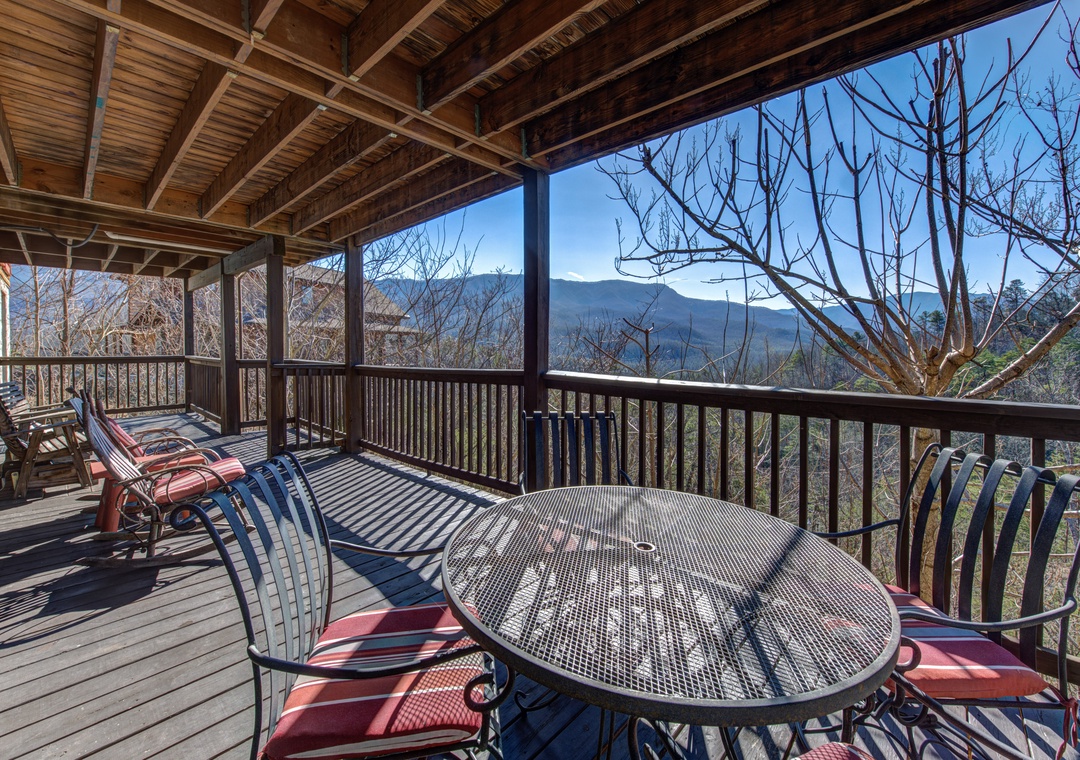 Breathe in mountain air on your covered deck where breakfast tastes better with sweeping valley views stretching to distant peaks.