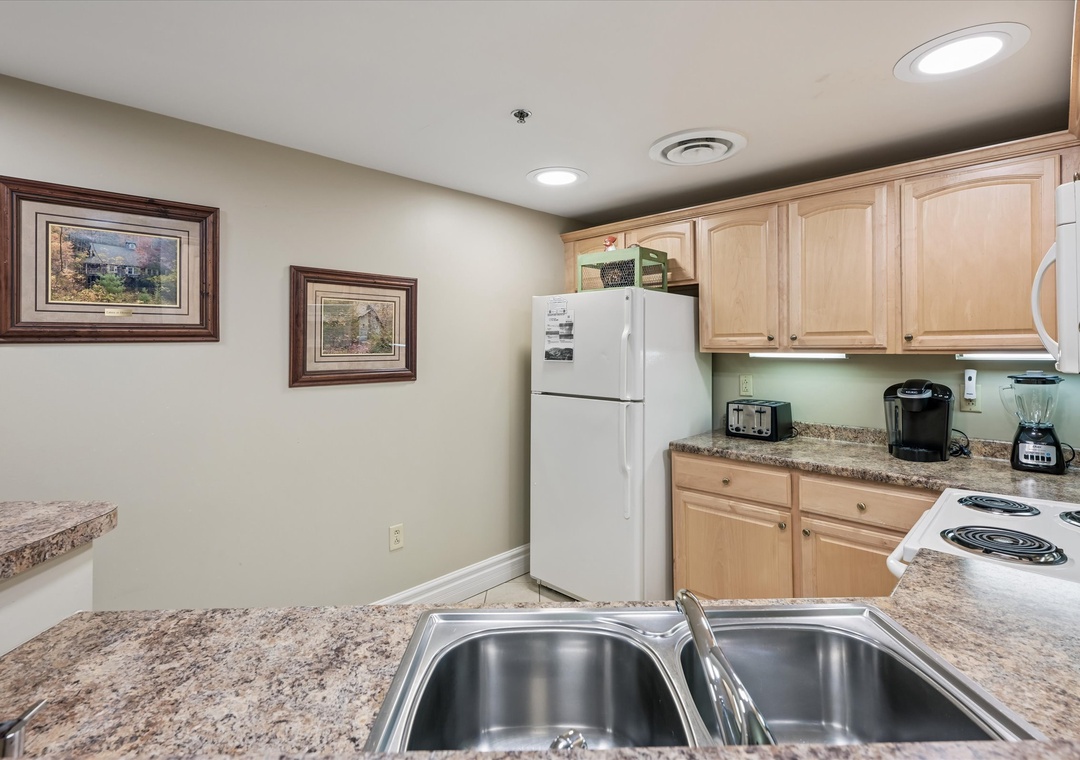 Your fully equipped kitchen features granite counters, modern appliances, and everything you need to prepare delicious meals during your stay.