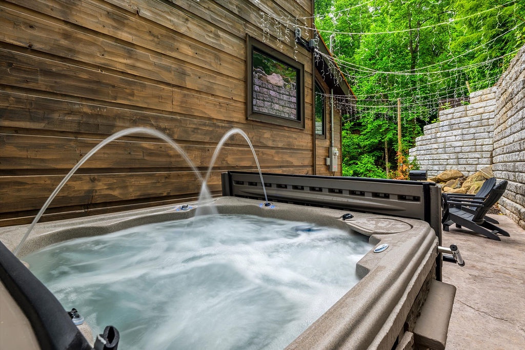 Soak away the day in your private hot tub, nestled among lush trees and wrapped in the warmth of natural wood surroundings.