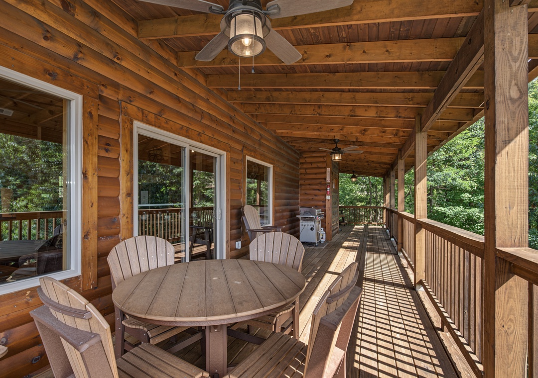Gather around for meals in the open air on your private deck, complete with a grill and surrounded by peaceful forest views.
