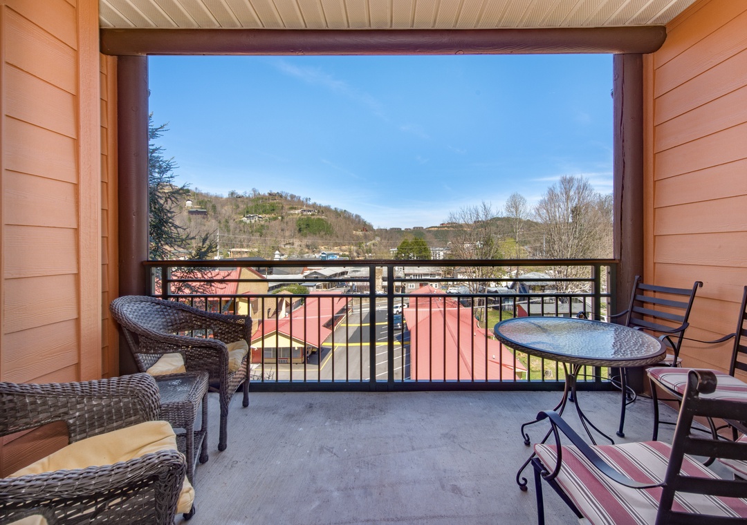 Unwind on your private balcony with mountain views, perfect for morning coffee or evening relaxation with comfortable seating.