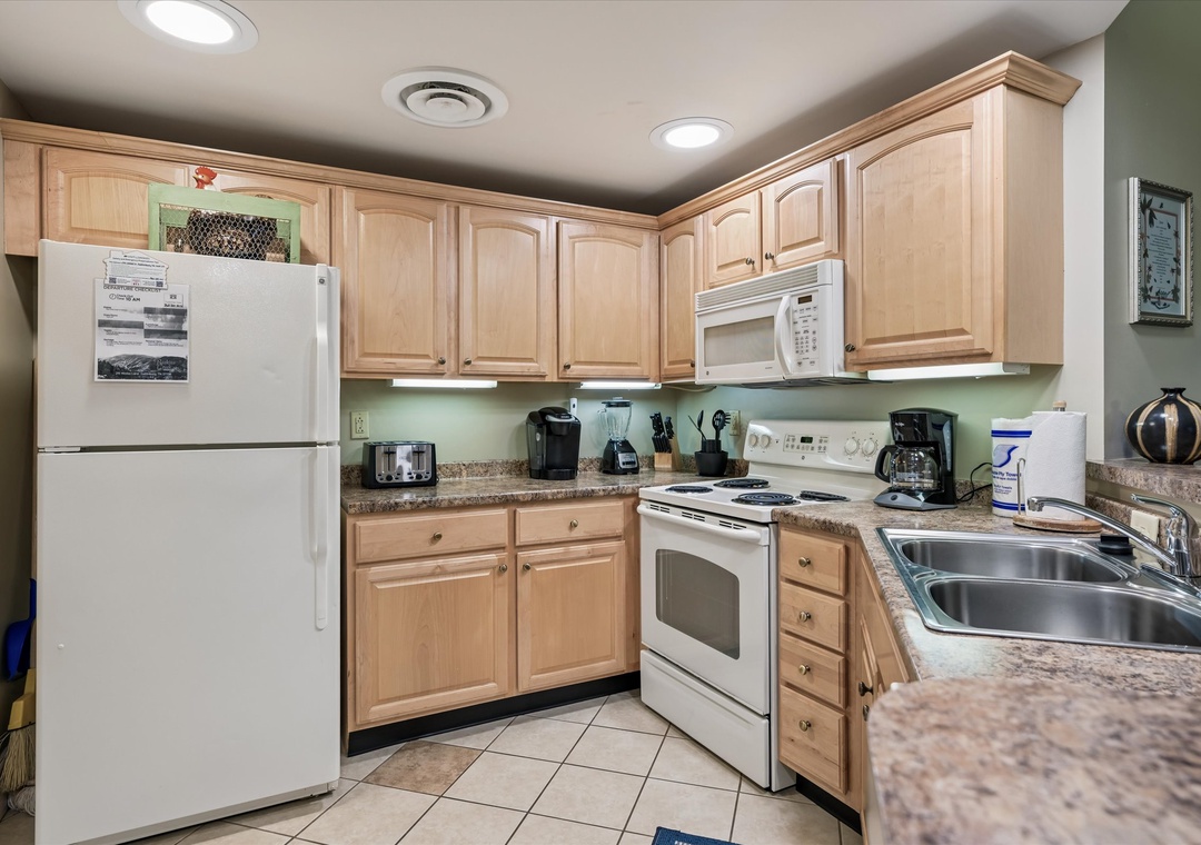 Your fully equipped kitchen features everything needed for home-cooked meals, from granite counters to modern appliances.