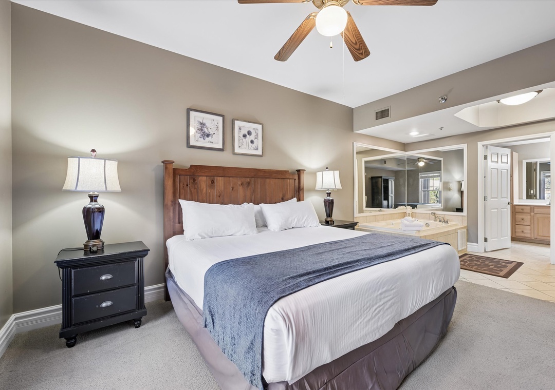 Unwind in your spacious master bedroom featuring a king-size bed, elegant furnishings, and ensuite bathroom for ultimate comfort.