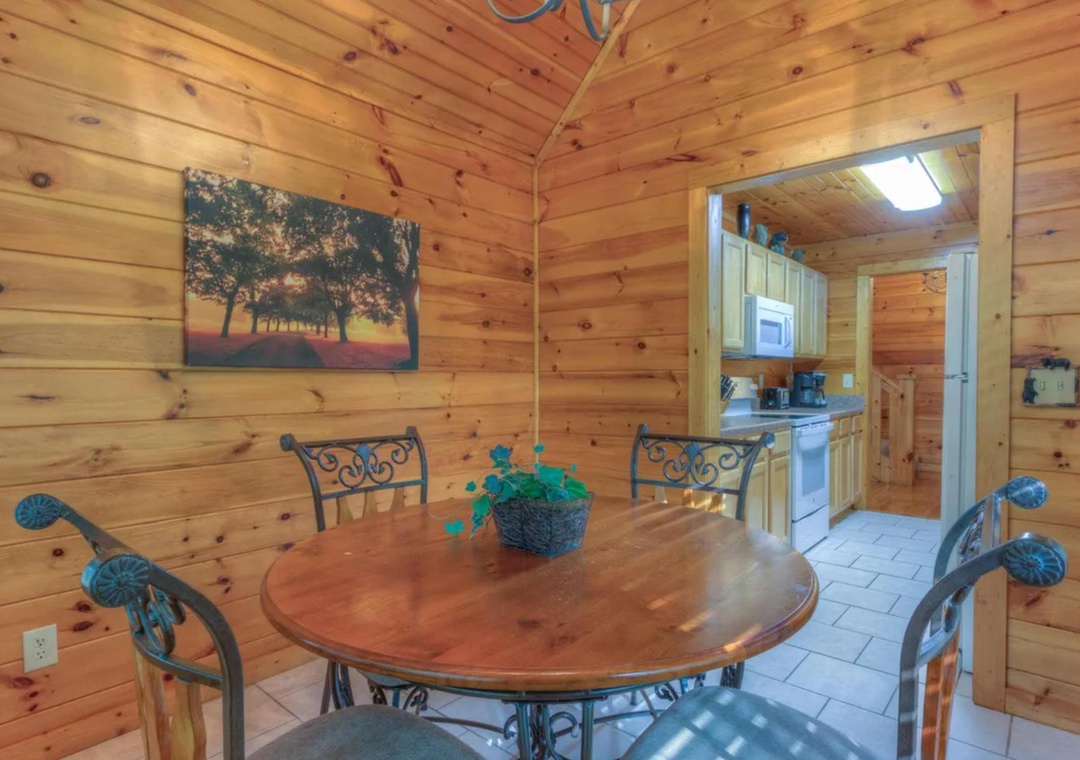Gather around the warm wood-paneled dining area, where natural light brightens your meals and conversation flows easily from table to kitchen.