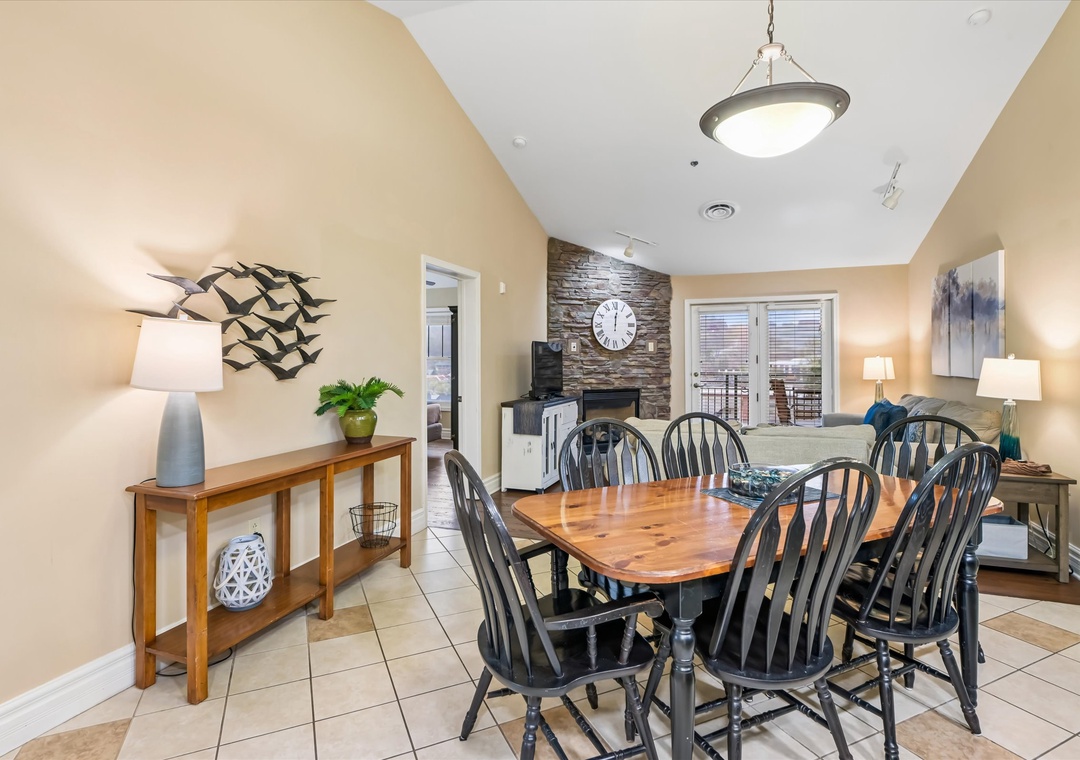 Gather around your dining table with cozy seating for eight, featuring warm lighting and modern decor for memorable meals together.