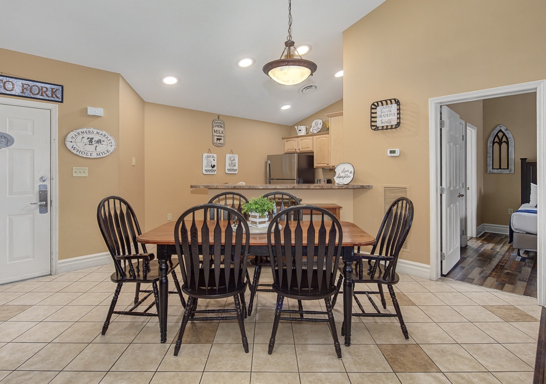 Gather around this charming farmhouse dining table for memorable meals with your loved ones in this warm, welcoming space.