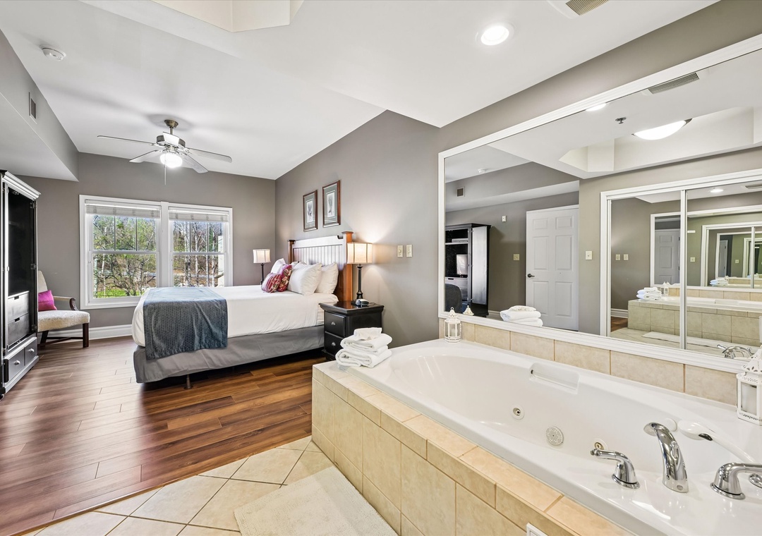 Relax in your elegant suite with a luxurious jetted tub right beside your bed, perfect for romantic getaways or pure indulgence.