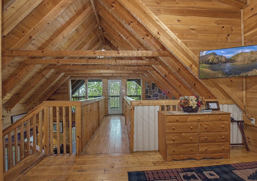 Relax in this cozy loft space with beautiful wood beams and your own flat-screen TV for peaceful evenings.