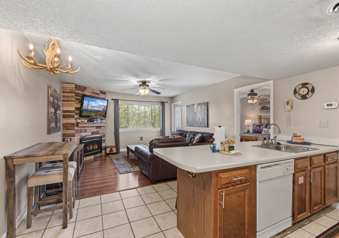 Relax in your open-concept mountain retreat with rustic charm, cozy fireplace, and modern kitchen perfect for cooking together.
