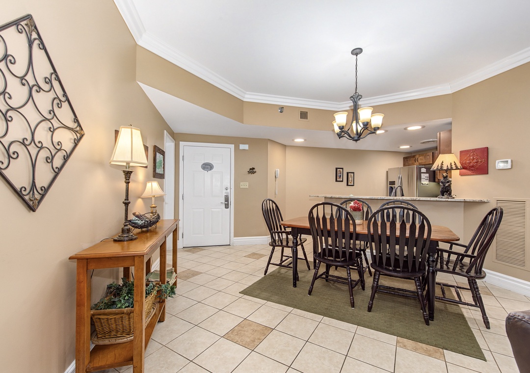 Gather around your elegant dining table for memorable meals in this warm, inviting space with beautiful tiled floors and charming decor.