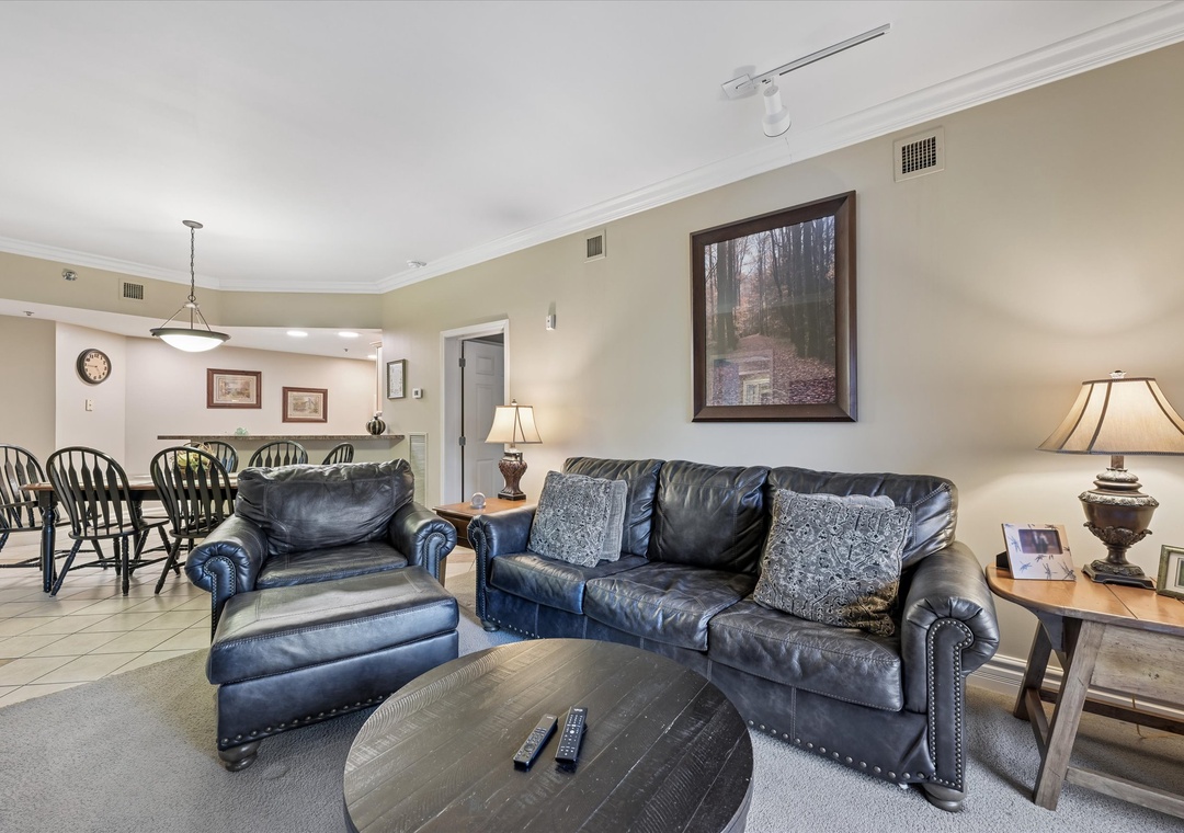 Sink into plush leather seating in your spacious living area, where warm lighting and thoughtful décor create the perfect retreat after exploring.