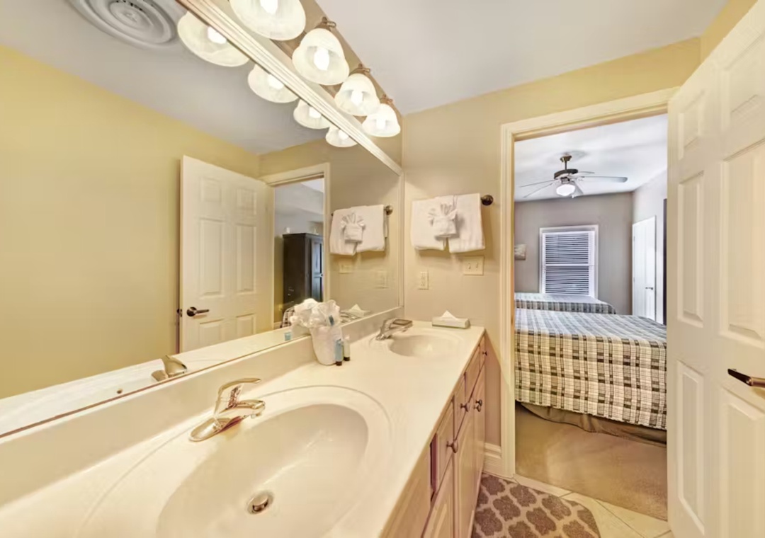 Your private bathroom features a spacious vanity with dual sinks, perfect for getting ready together in comfort.