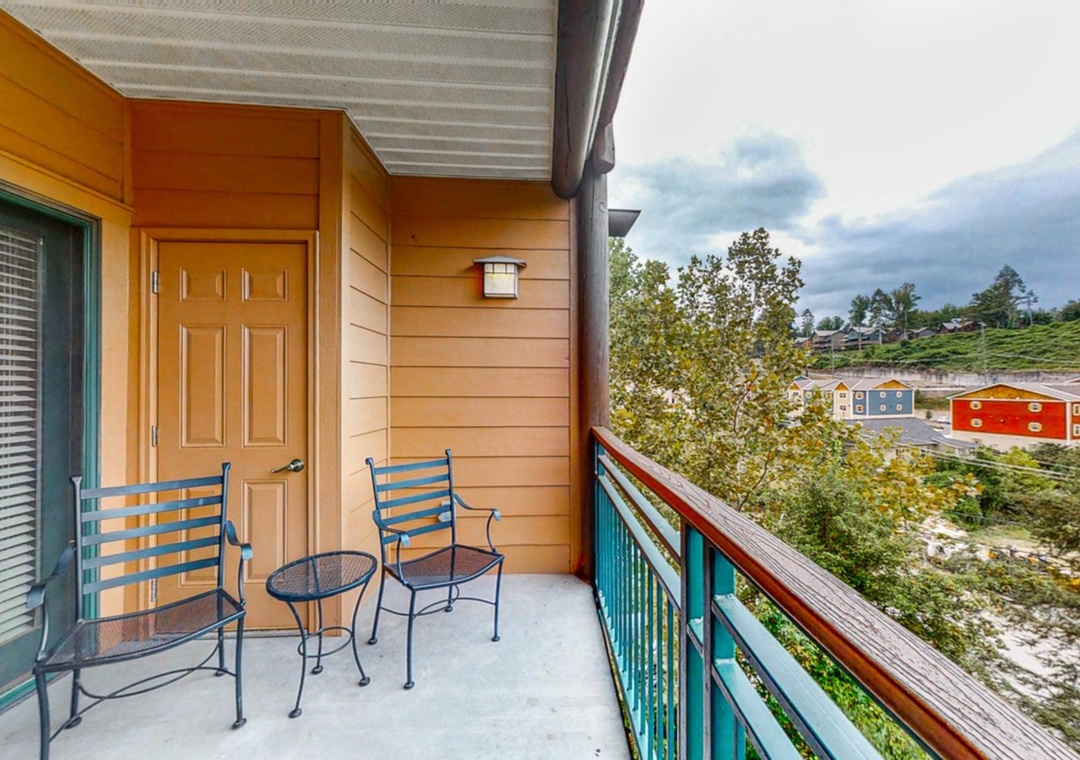 Your private balcony offers colorful seating where you can unwind while taking in peaceful neighborhood views and fresh air.