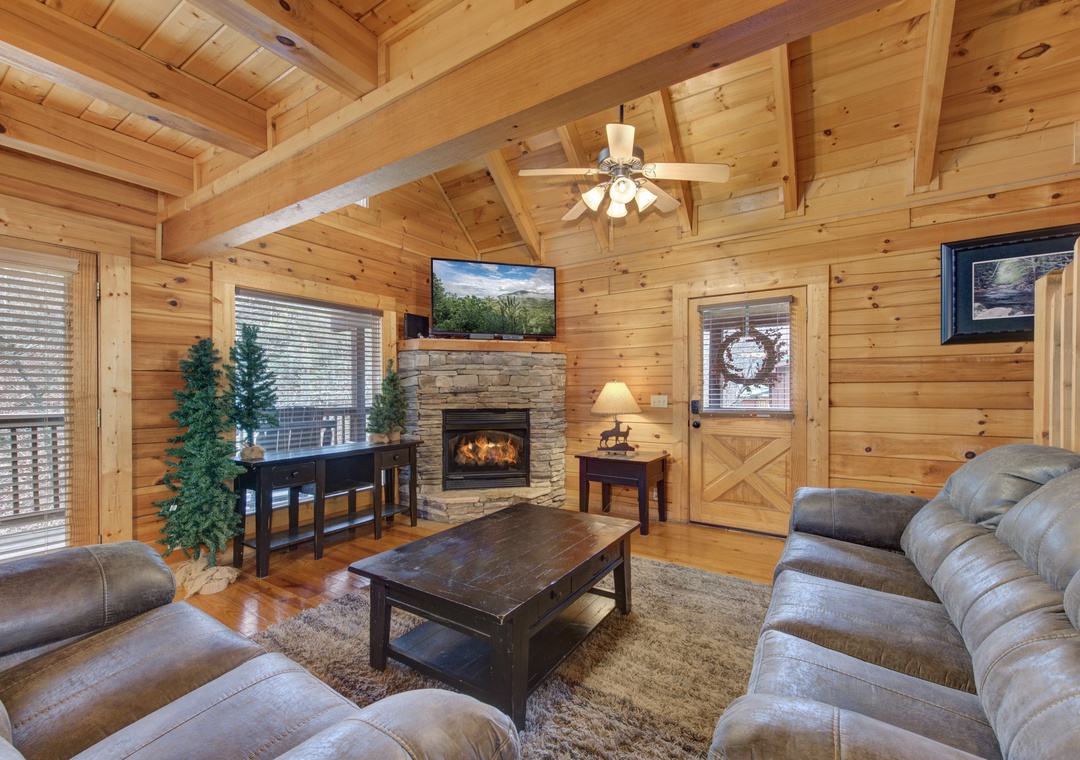 Sink into plush leather seating by your crackling fireplace, where rustic wood beams frame cozy evenings together.