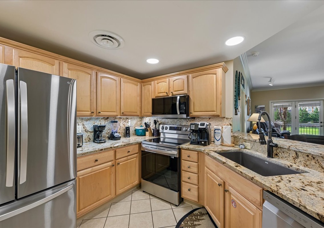 Your fully equipped kitchen features granite countertops, stainless steel appliances, and everything you need to create memorable meals during your stay.