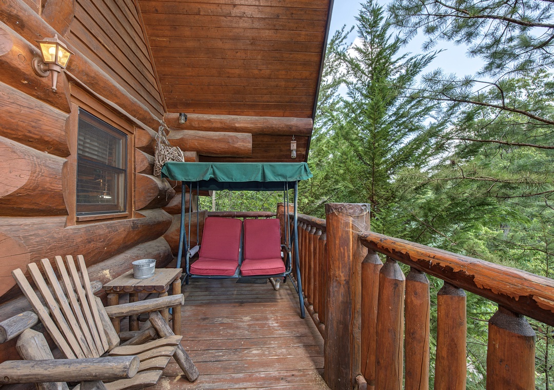 Step onto your private deck and breathe in the fresh mountain air. Sink into the cozy swing or rustic chairs, surrounded by towering pines—your perfect spot to unwind and soak in nature's tranquility.