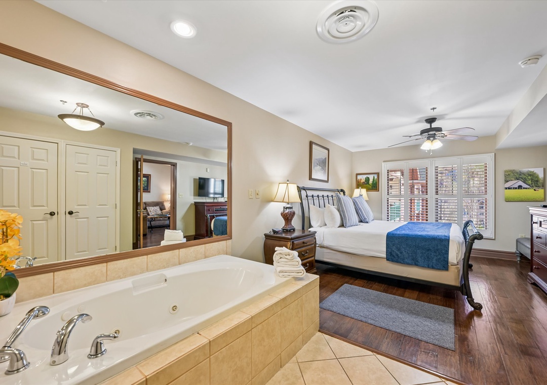 Unwind in your luxurious suite featuring a relaxing jetted tub and plush king bed with crisp linens.