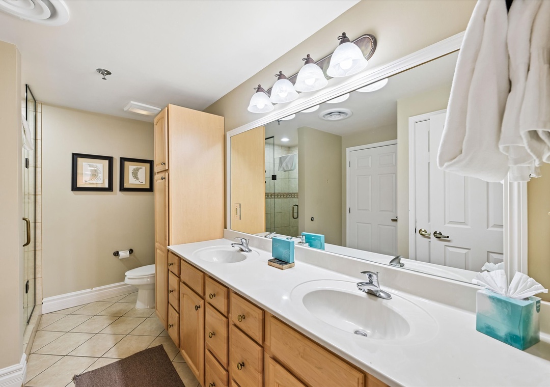 Refresh in your spacious bathroom with dual vanities, ample counter space, and soft towels ready for your stay.