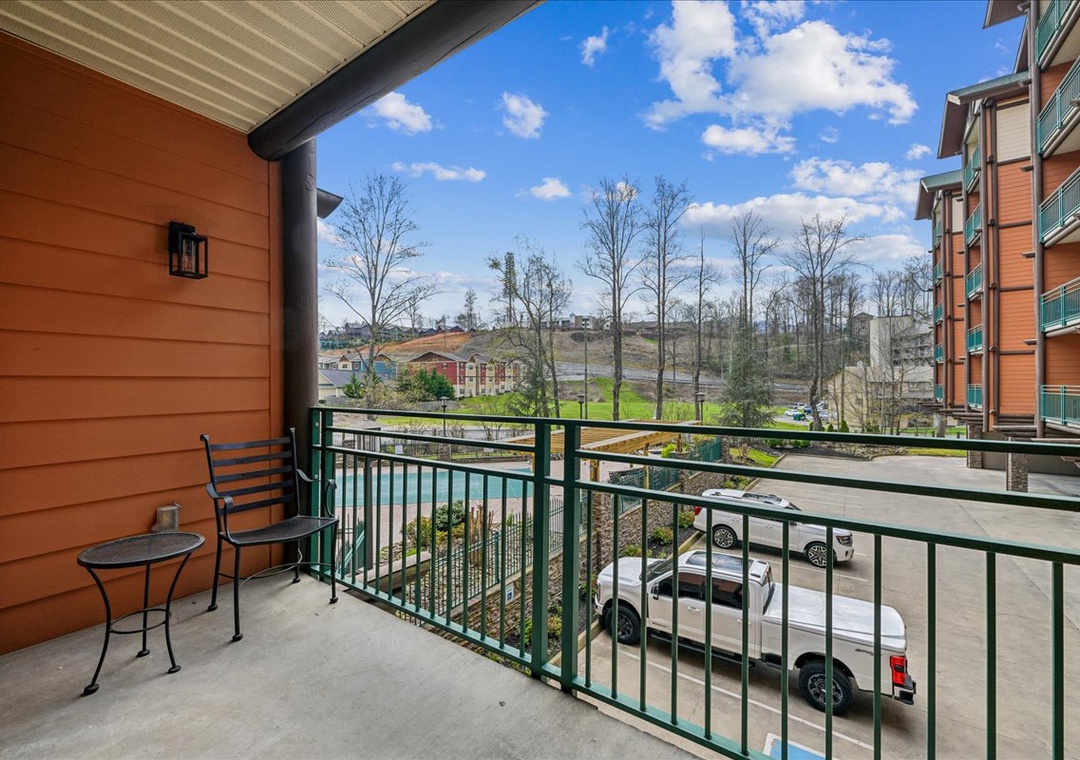 Step onto your private balcony and breathe in the fresh mountain air while enjoying peaceful views of the surrounding landscape and convenient parking below.