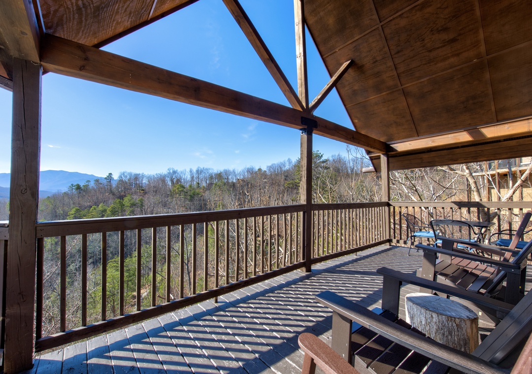 Relax on your private covered balcony with stunning mountain views, where morning coffee tastes better surrounded by peaceful forest landscapes.
