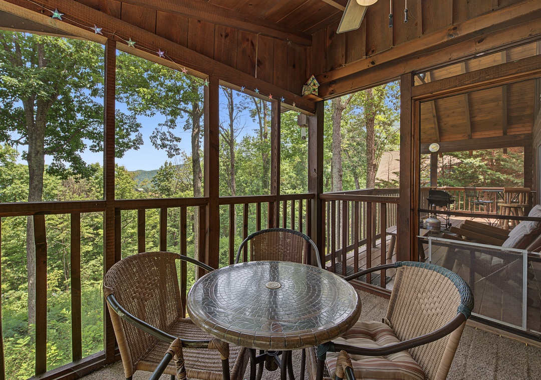 Sip your morning coffee surrounded by forest canopy and mountain views from your private screened porch. This peaceful perch offers the perfect spot to unwind and reconnect with nature.