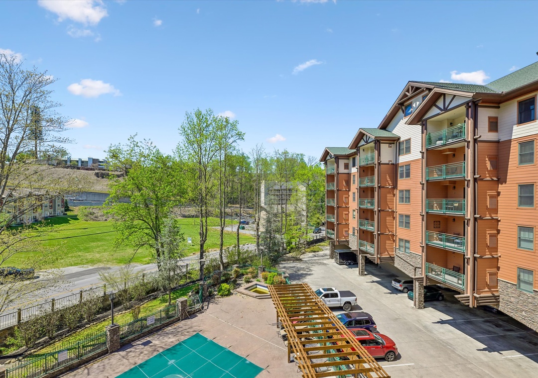 Multi-story vacation rental complex featuring modern amenities and convenient parking in a scenic mountain setting.