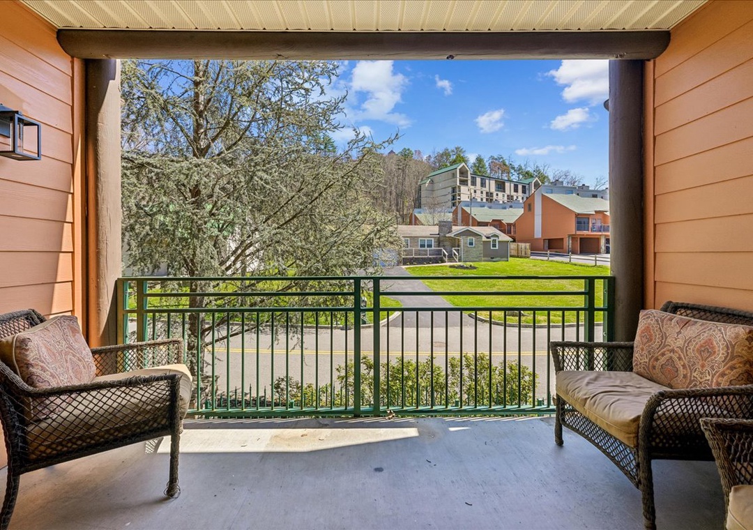 Settle into your private balcony chairs and soak in peaceful views of green lawns and charming neighborhood homes.