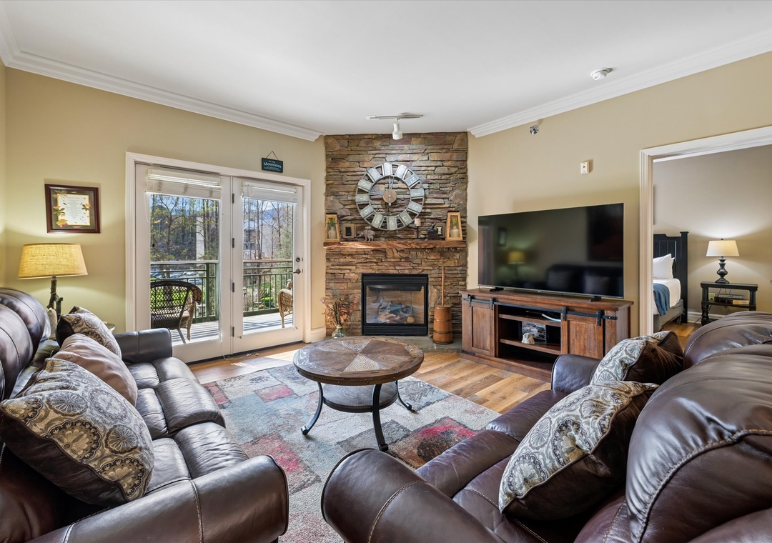 Sink into plush leather seating by your crackling fireplace, while natural light streams through French doors to your private balcony.