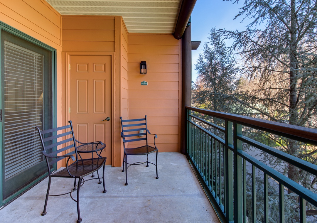 Step onto your private balcony and unwind with morning coffee while taking in peaceful tree-lined views.
