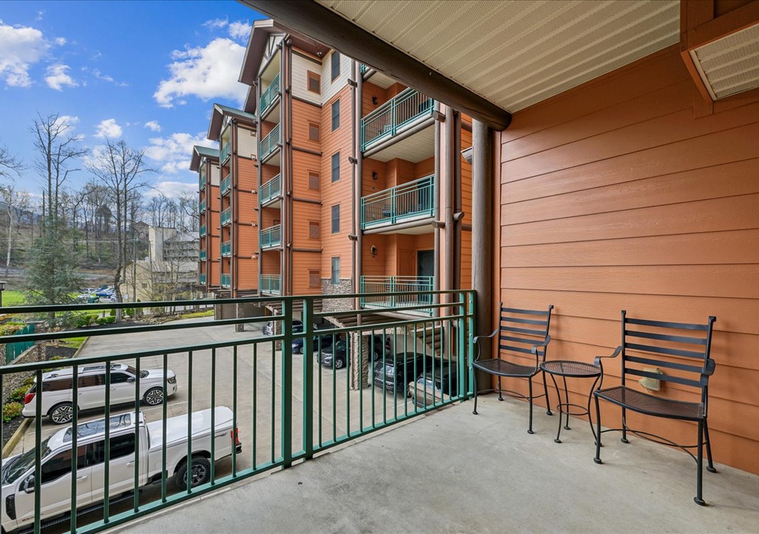 Step onto your private balcony with outdoor seating, perfect for morning coffee or evening relaxation while taking in the peaceful property views.