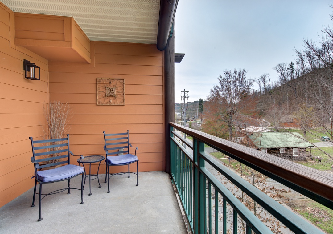 Step onto your private balcony and unwind in comfortable seating while enjoying peaceful mountain views and fresh air.
