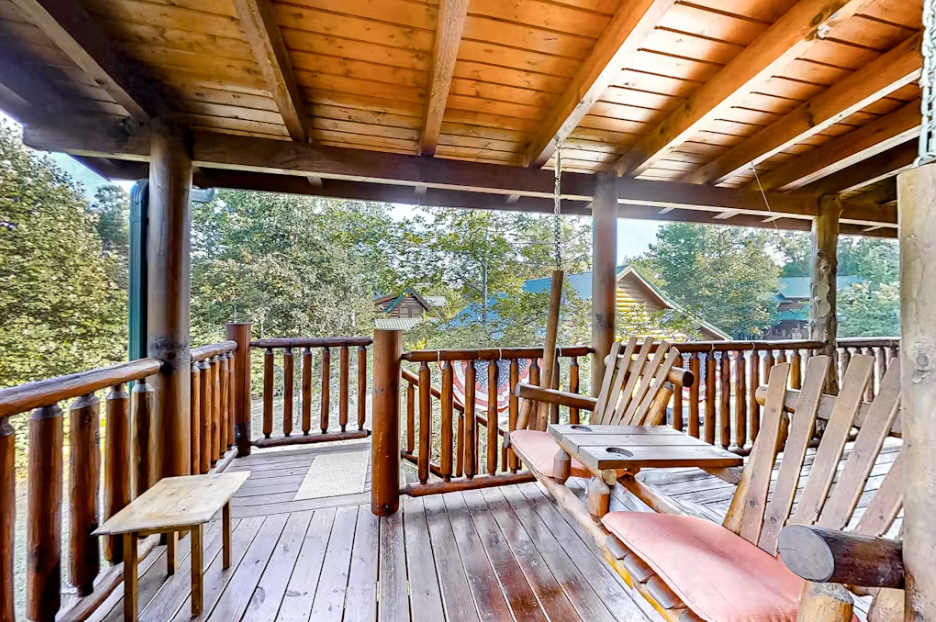 Relax on your private covered deck with handcrafted wooden furniture and peaceful forest views.