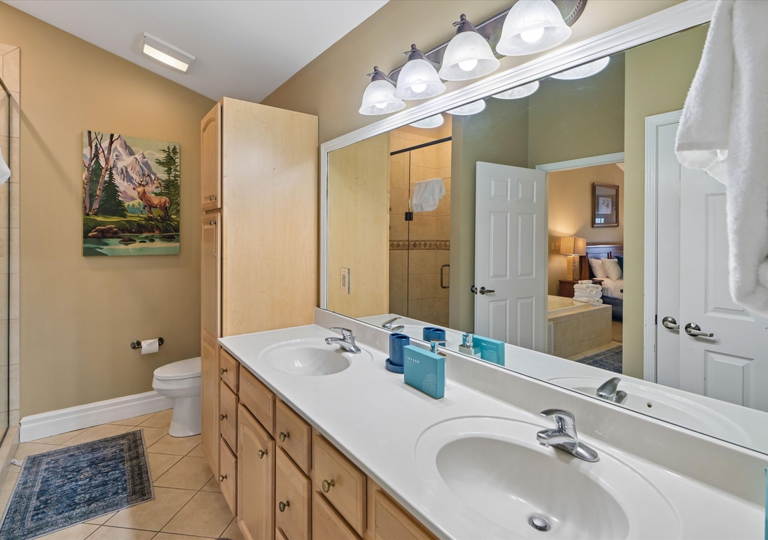 Your spacious bathroom features dual vanities and modern fixtures for convenient morning routines.