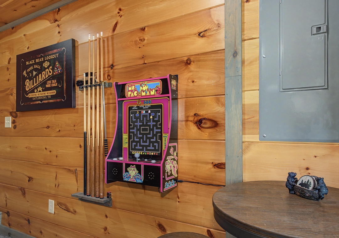 Challenge friends to classic arcade fun in your own game room, complete with billiards and nostalgic Ms. Pac-Man—perfect for lively evenings in the cabin.