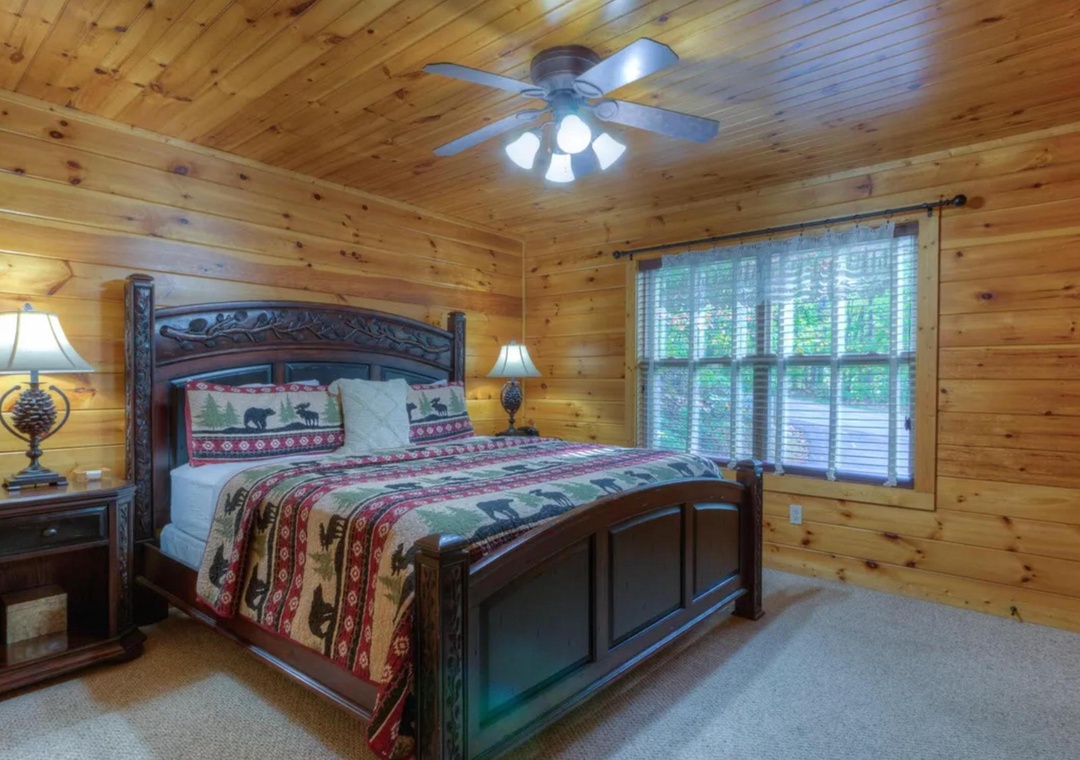 Unwind in your cozy cabin bedroom beneath warm wooden beams, where rustic charm meets comfort with a beautifully carved bed and soft natural light filtering through the trees.