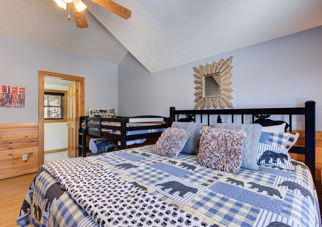Cozy cabin bedroom where you'll drift off surrounded by rustic charm and mountain-inspired décor.