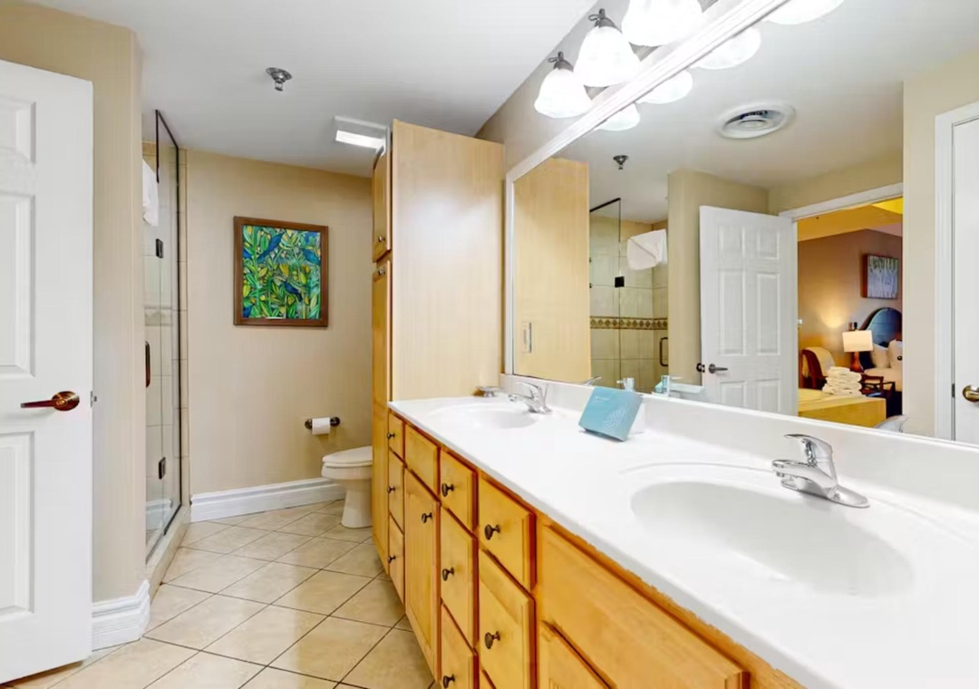 Spacious bathroom with dual sinks and ample counter space makes your morning routine effortless and comfortable.