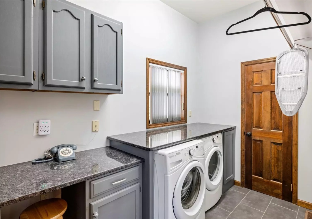 Your dedicated laundry room features full-size washer and dryer with granite counters for folding—making extended stays effortless.
