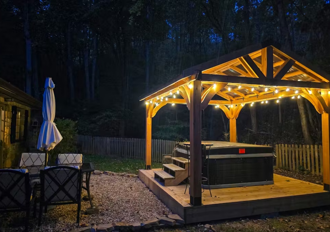 Soak under the stars in your private hot tub gazebo, where twinkling lights create the perfect ambiance for romantic evenings.