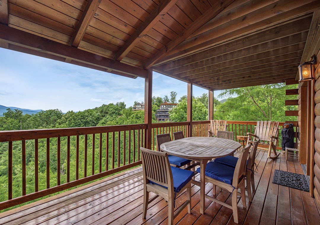 Sip your morning coffee at the dining table while taking in stunning mountain vistas and lush greenery from your covered deck—your peaceful retreat awaits.