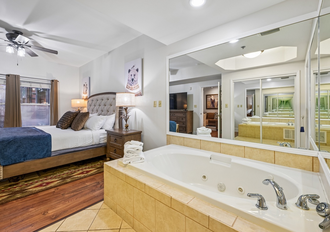 Unwind in your romantic suite featuring a luxurious jetted tub and plush king bed, perfect for your intimate getaway.