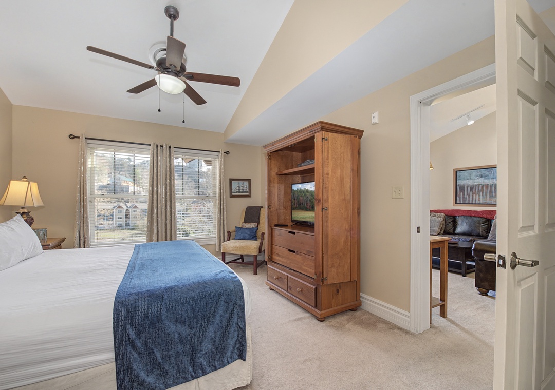 Sink into your plush king bed under the soothing ceiling fan, with built-in entertainment center and peaceful views.