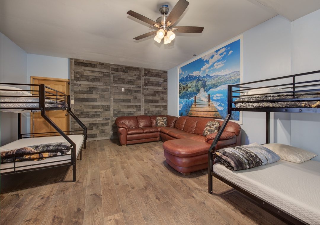 Your spacious room features bunk beds and a comfy leather sofa, perfect for families or groups seeking comfort.