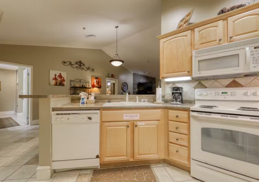 Your fully equipped kitchen awaits with modern appliances, ample counter space, and everything you need to create memorable meals during your stay.