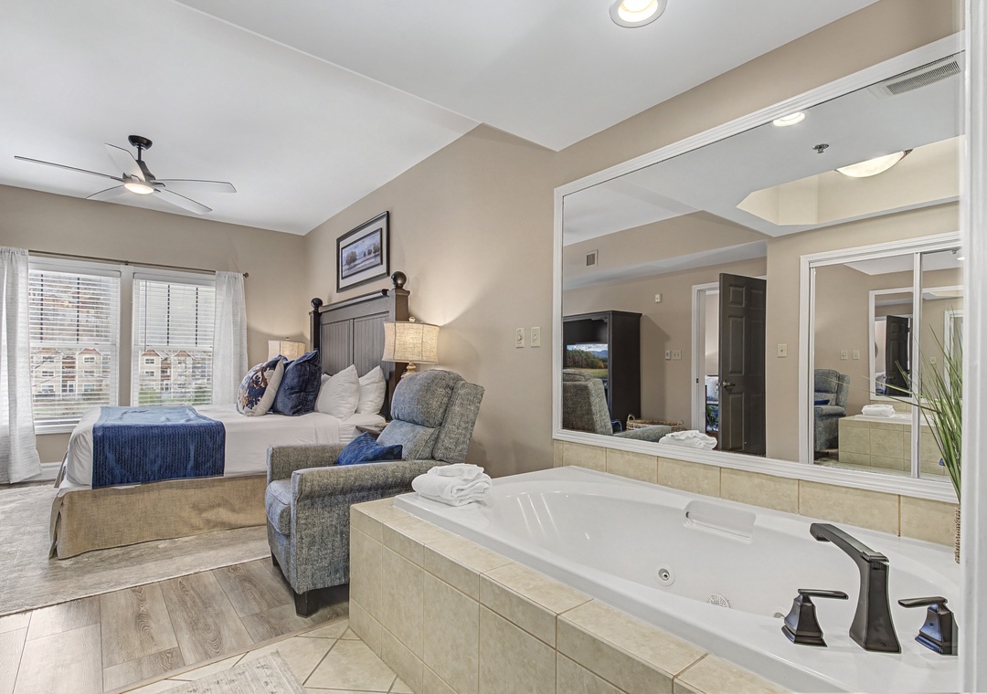 Unwind in your luxurious suite where a soothing jetted tub awaits just steps from your comfortable bed—perfect for romantic evenings.
